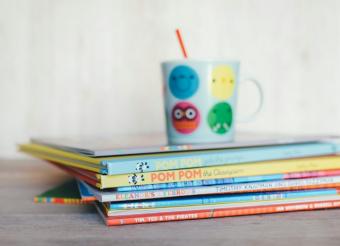 stack of books with mug